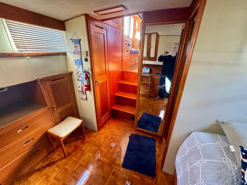 Slide: The Image of Interior of 1979 Grand Banks Classic yacht with wooden furnishings and cozy decor. - 36