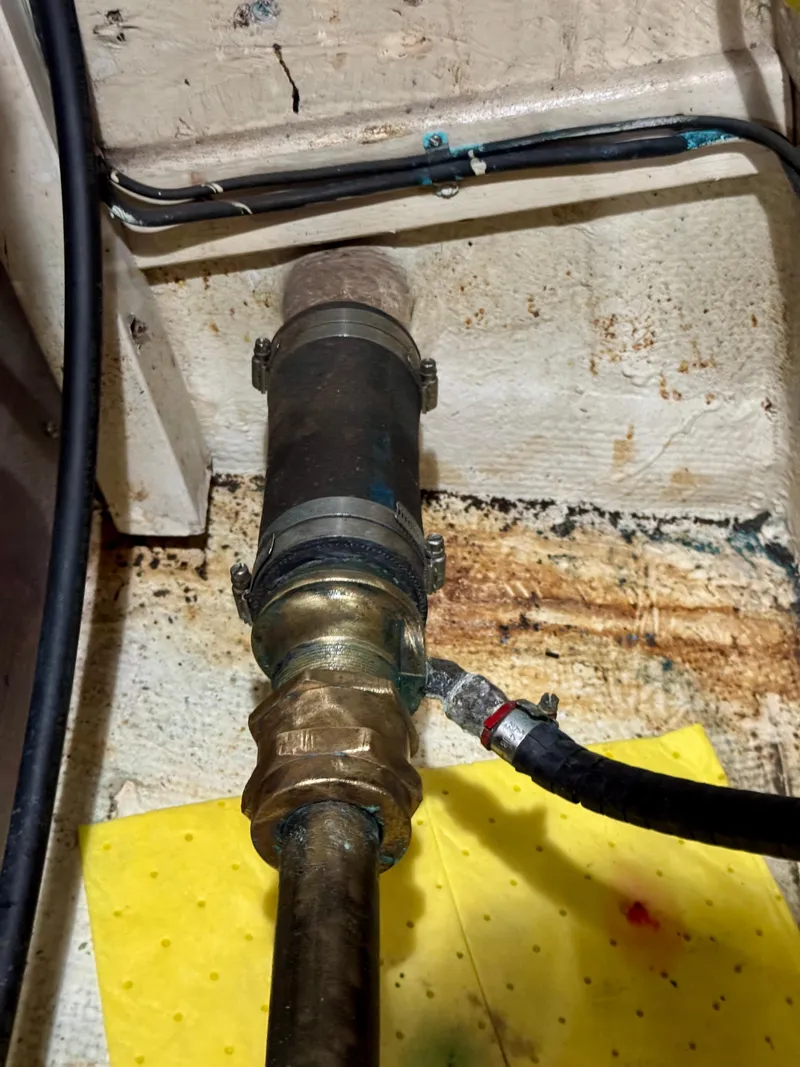 Slide: The Image of 1979 Grand Banks Classic boat engine compartment with visible piping and wiring. - 39