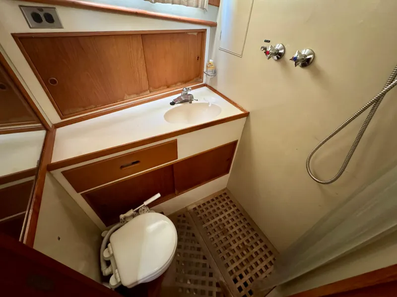 Slide: The Image of 1979 Grand Banks Classic yacht bathroom with sink, shower, and toilet. - 6