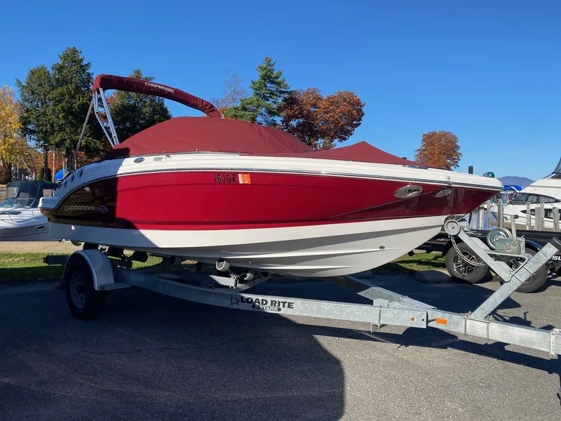 Slide: The Image of 2013 Chaparral 196 SSi boat on trailer, red cover, parked outdoors. - 2