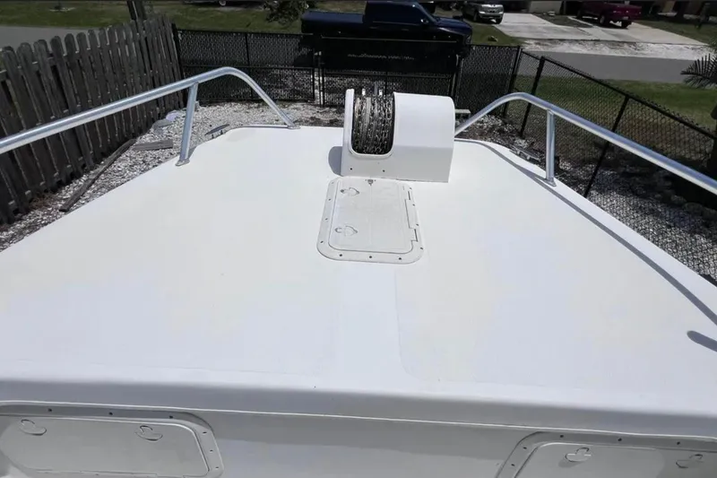 Slide: The Image of 2005 Twin Vee 22 Ocean Classic boat deck with railing and anchor winch. - 11