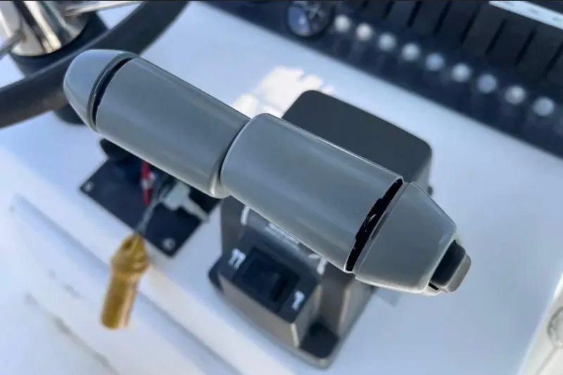 Slide: The Image of Close-up of throttle control on 2005 Twin Vee 22 Ocean Classic boat. - 17