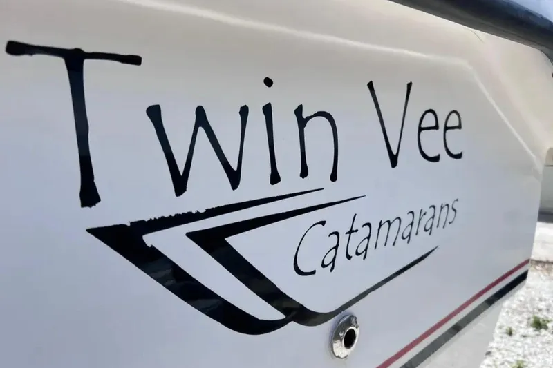 Slide: The Image of Close-up of 2005 Twin Vee 22 Ocean Classic catamaran logo on boat hull. - 5