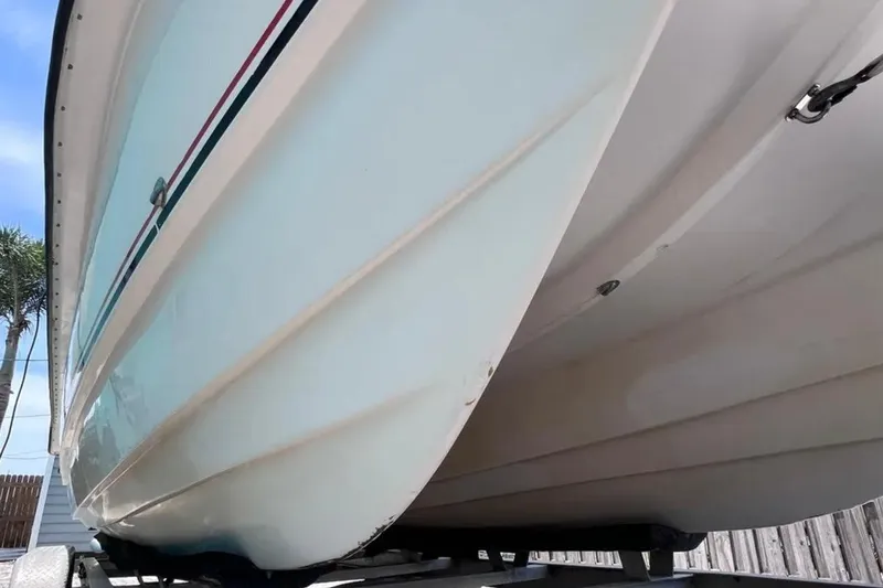 Slide: The Image of 2005 Twin Vee 22 Ocean Classic boat hull on trailer, showcasing sleek design. - 6