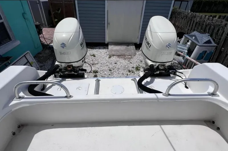 Slide: The Image of 2005 Twin Vee 22 Ocean Classic boat with dual Suzuki 140 outboard motors. - 9