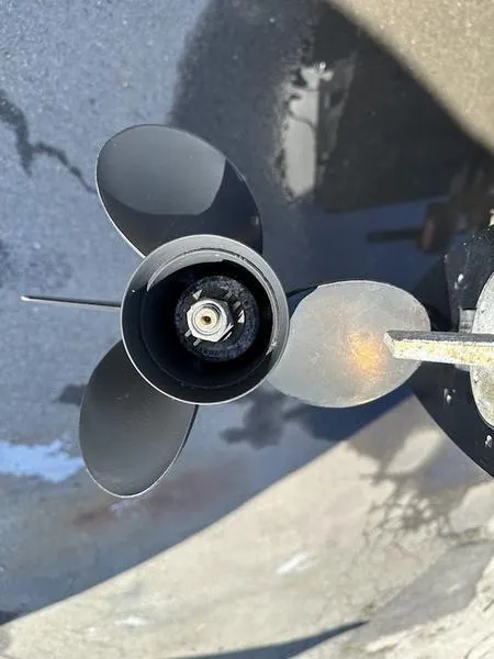 Slide: The Image of Propeller of 2005 Boston Whaler 130 Super Sport boat, close-up view. - 8