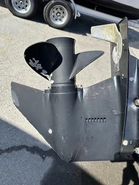 Slide: The Image of Close-up of a 2005 Boston Whaler 130 Super Sport boat propeller and lower unit. - 9