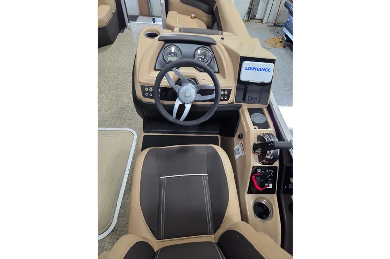 Slide: The Image of 2025 Barletta Cabrio 22QC boat dashboard with steering wheel and Lowrance display. - 10