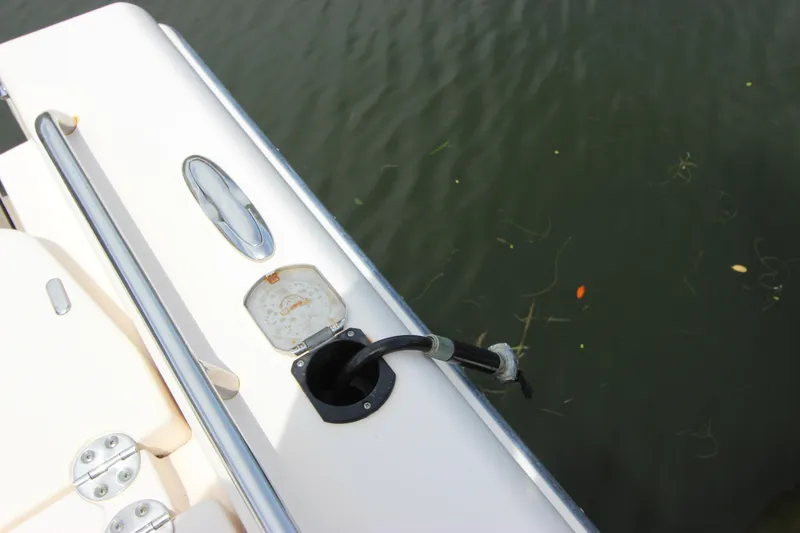 Slide: The Image of Grady-White 251 Coastal Explorer 2015 boat fuel port by water. - 10