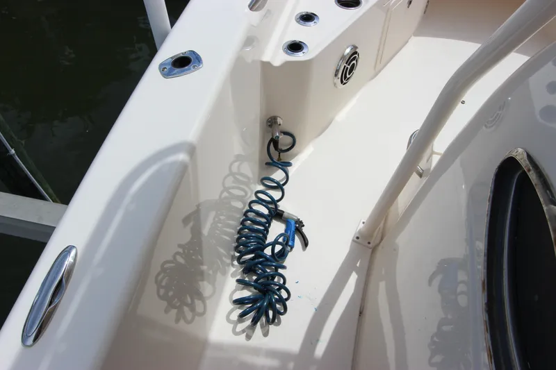 Slide: The Image of Grady-White 251 Coastal Explorer 2015 boat deck with coiled blue hose. - 11
