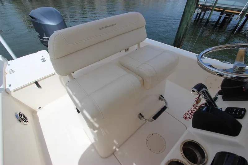 Slide: The Image of 2015 Grady-White 251 Coastal Explorer boat interior with helm seat and steering wheel. - 13