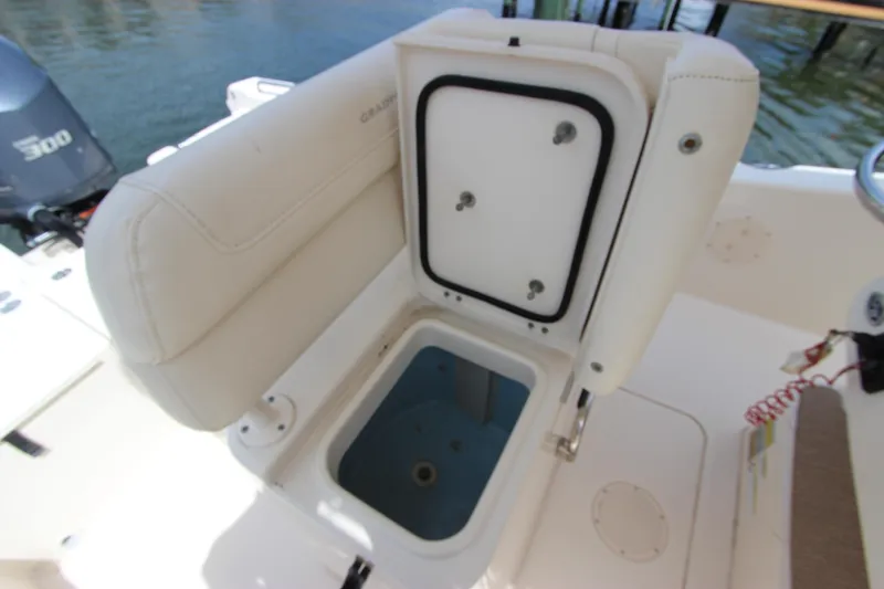 Slide: The Image of 2015 Grady-White 251 Coastal Explorer boat with open storage compartment. - 14