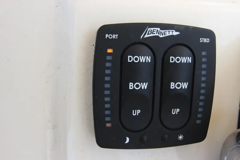 Slide: The Image of Bennett trim tab control panel on 2015 Grady-White 251 Coastal Explorer boat. - 18