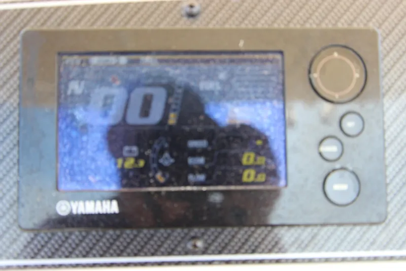 Slide: The Image of Yamaha display on 2015 Grady-White 251 Coastal Explorer boat dashboard. - 19