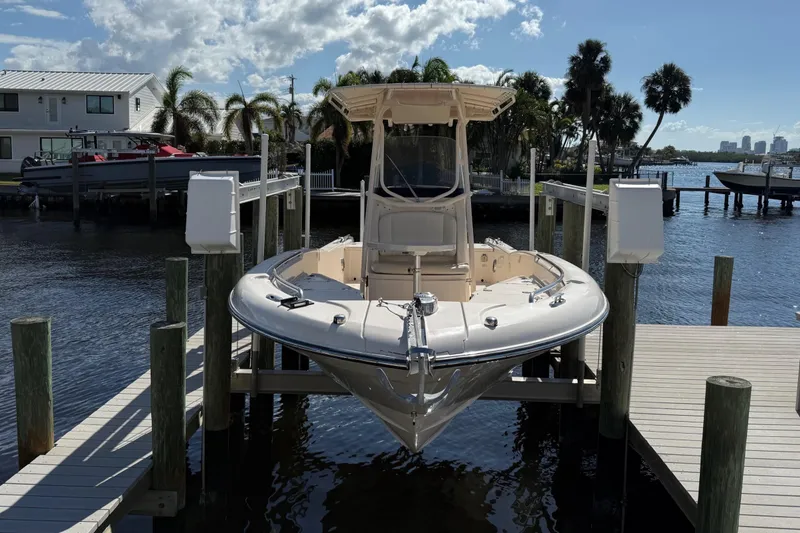 Slide: The Image of 2015 Grady-White 251 Coastal Explorer boat docked on a sunny day. - 2