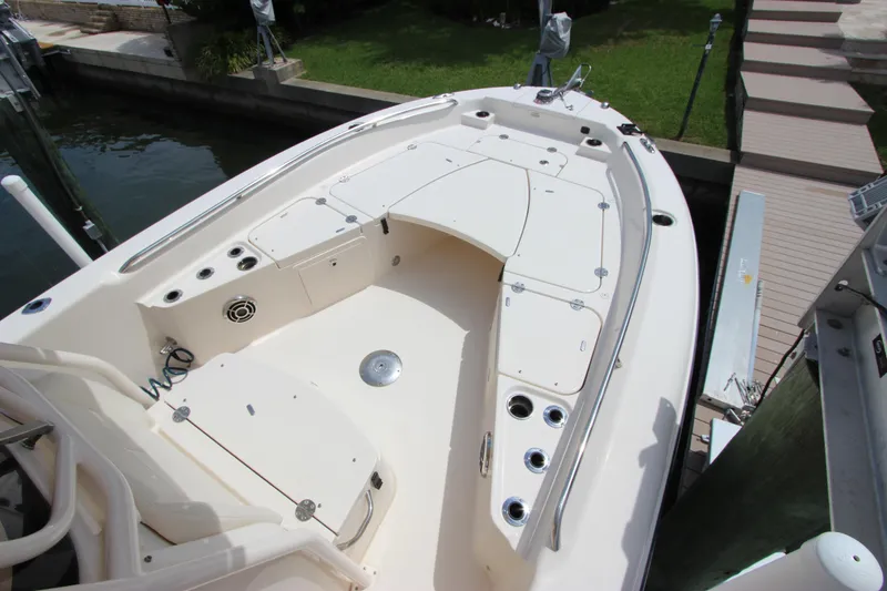 Slide: The Image of 2015 Grady-White 251 Coastal Explorer boat deck with seating and rod holders. - 23