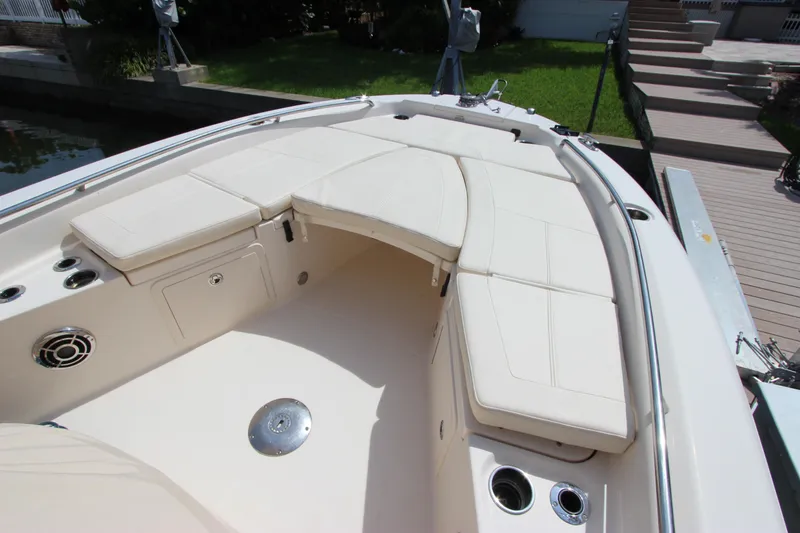 Slide: The Image of 2015 Grady-White 251 Coastal Explorer boat with cushioned seating and cup holders. - 24