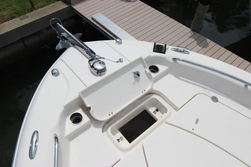 Slide: The Image of 2015 Grady-White 251 Coastal Explorer boat deck with anchor and storage compartments. - 25