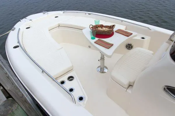 Slide: The Image of Grady-White 251 Coastal Explorer 2015 boat interior with seating and table setup. - 28