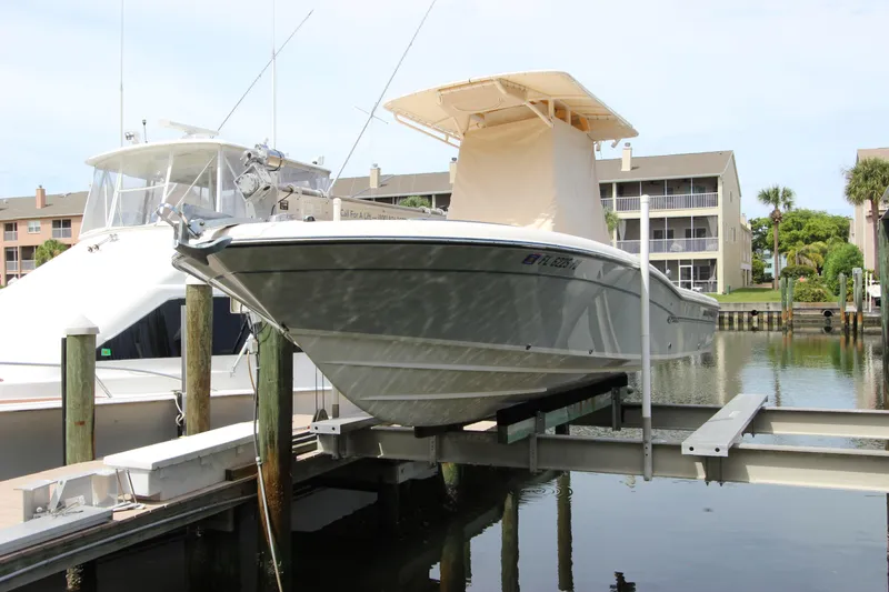 Slide: The Image of 2015 Grady-White 251 Coastal Explorer boat docked in marina. - 3