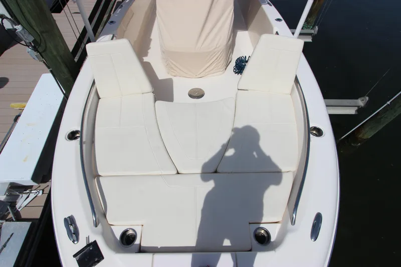 Slide: The Image of 2015 Grady-White 251 Coastal Explorer boat deck with cushioned seating and shadow. - 30