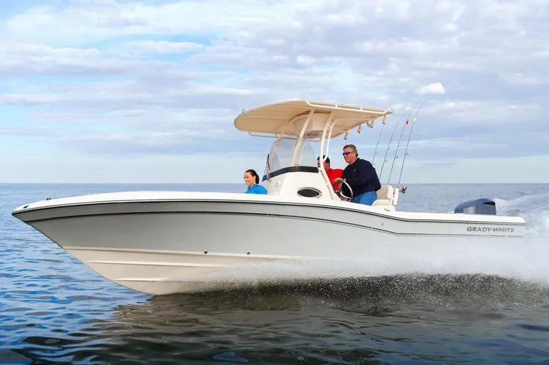 Slide: The Image of 2015 Grady-White 251 Coastal Explorer boat cruising on open water. - 34