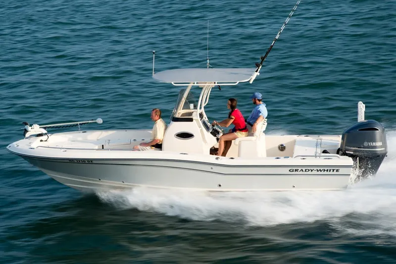 Slide: The Image of 2015 Grady-White 251 Coastal Explorer boat cruising on open water. - 35