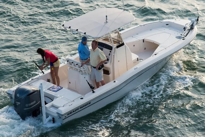 Slide: The Image of 2015 Grady-White 251 Coastal Explorer boat cruising with three people onboard. - 36
