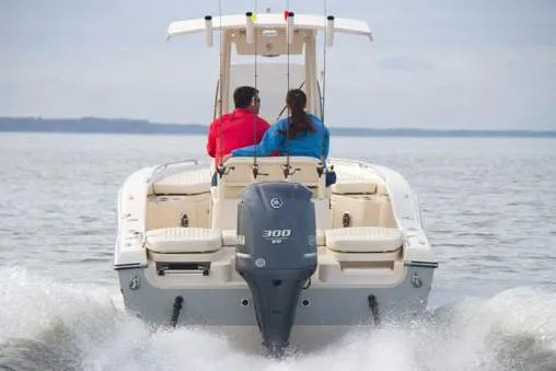 Slide: The Image of 2015 Grady-White 251 Coastal Explorer boat cruising on open water. - 37