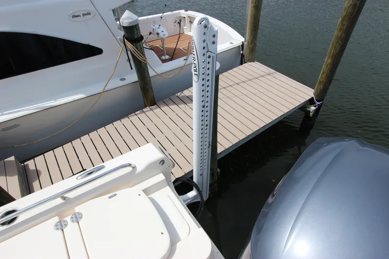 Slide: The Image of 2015 Grady-White 251 Coastal Explorer docked beside a wooden pier. - 5