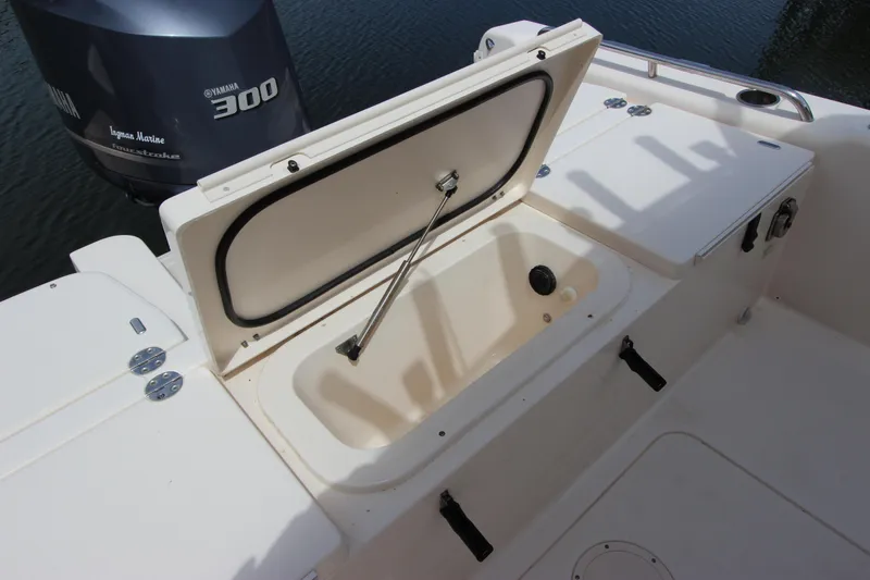 Slide: The Image of Open storage compartment on 2015 Grady-White 251 Coastal Explorer boat. - 8