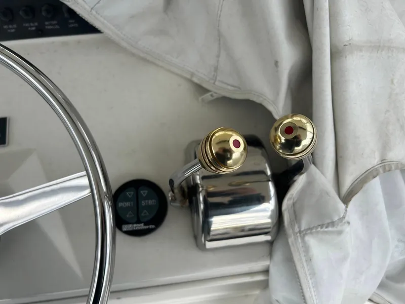 Slide: The Image of Close-up of 1996 Viking 43 Convertible Sportfish helm controls and steering wheel. - 11
