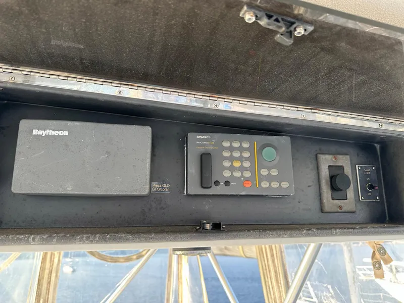 Slide: The Image of Control panel of a 1996 Viking 43 Convertible Sportfish boat with Raytheon equipment. - 16
