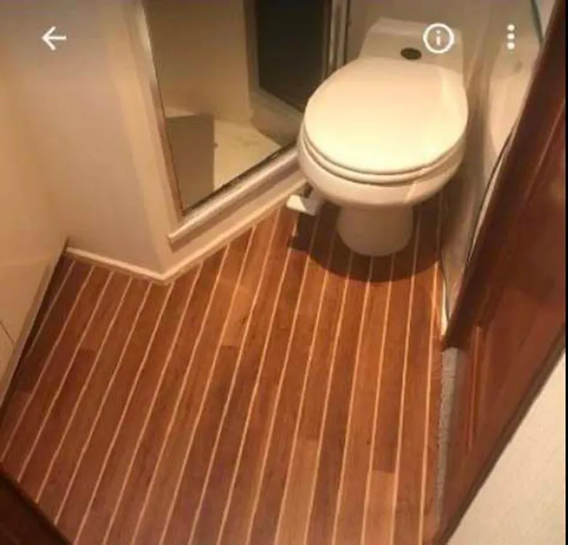Slide: The Image of Bathroom interior of 1996 Viking 43 Convertible Sportfish with wood flooring. - 23