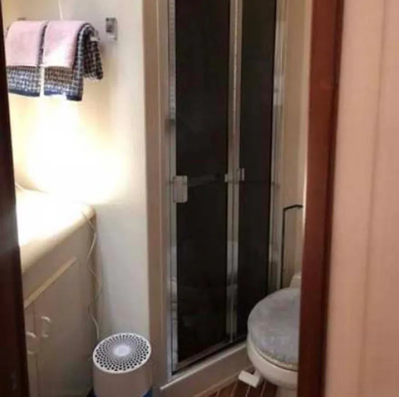 Slide: The Image of Bathroom interior of 1996 Viking 43 Convertible Sportfish yacht, featuring shower and toilet. - 25