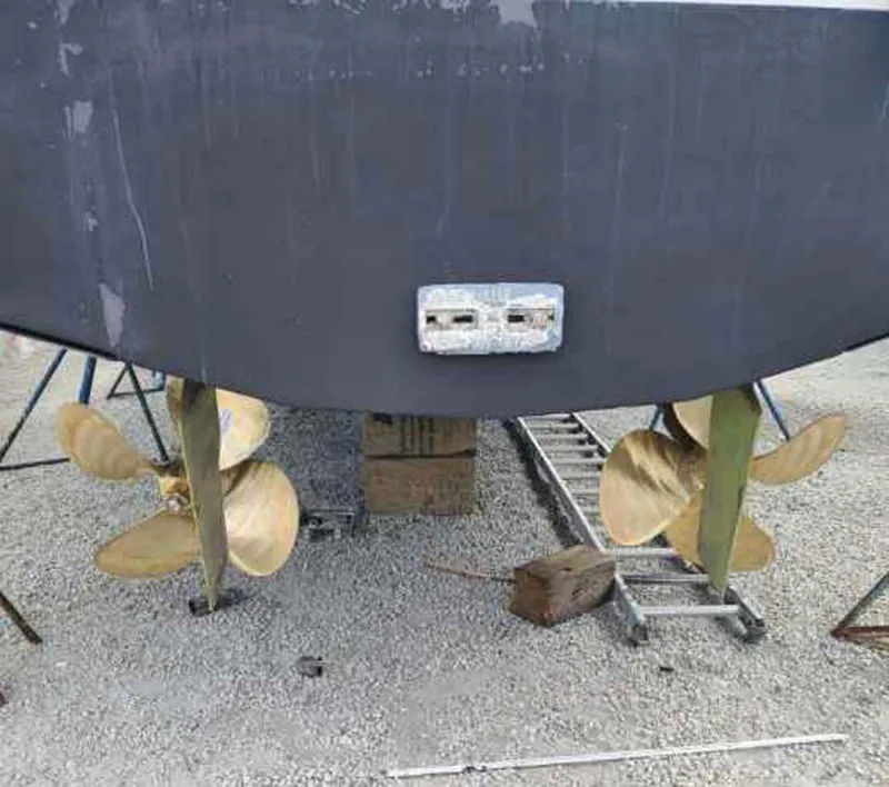 Slide: The Image of 1996 Viking 43 Convertible Sportfish boat propellers and rudders on display. - 30