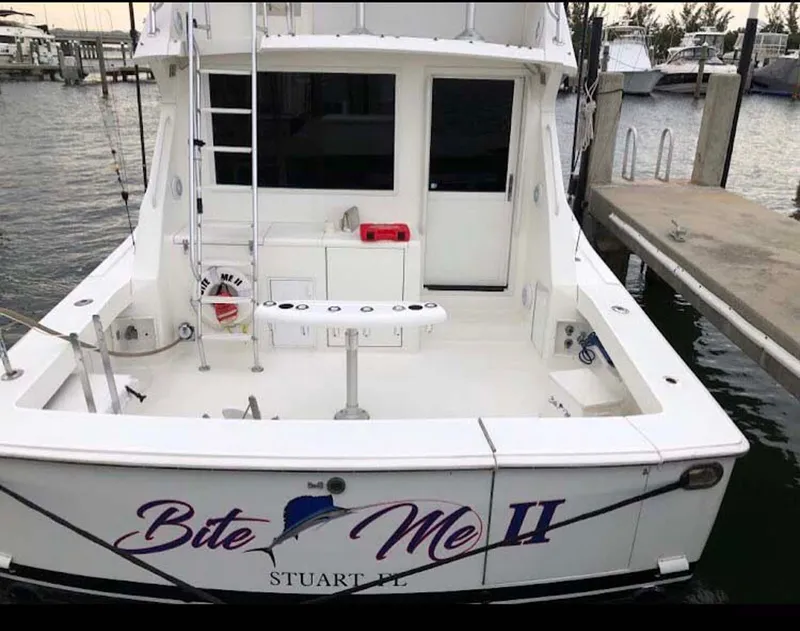 Slide: The Image of 1996 Viking 43 Convertible Sportfish boat docked, named "Bite Me II," Stuart, FL. - 32