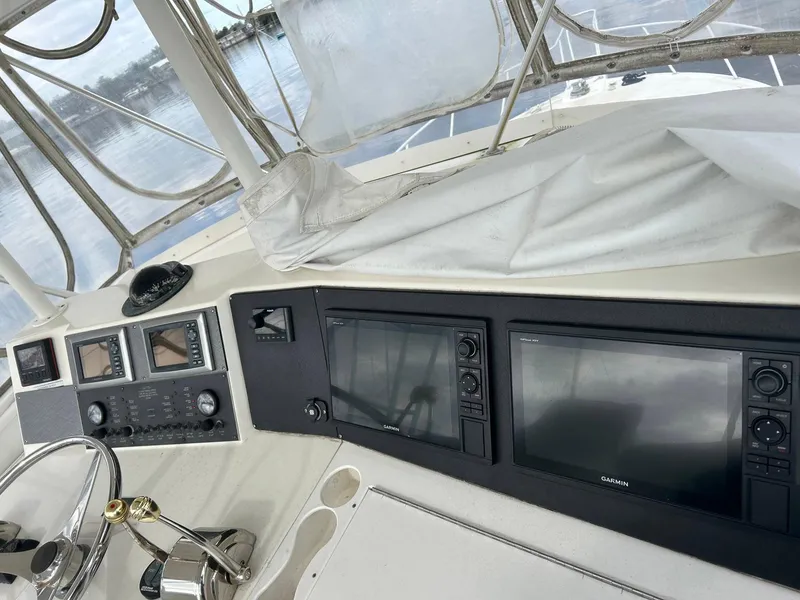 Slide: The Image of 1996 Viking 43 Convertible Sportfish helm with navigation screens and controls. - 7