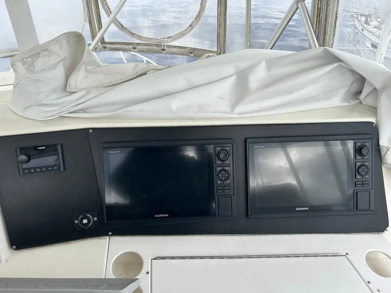 Slide: The Image of Dashboard of a 1996 Viking 43 Convertible Sportfish with Garmin displays. - 8