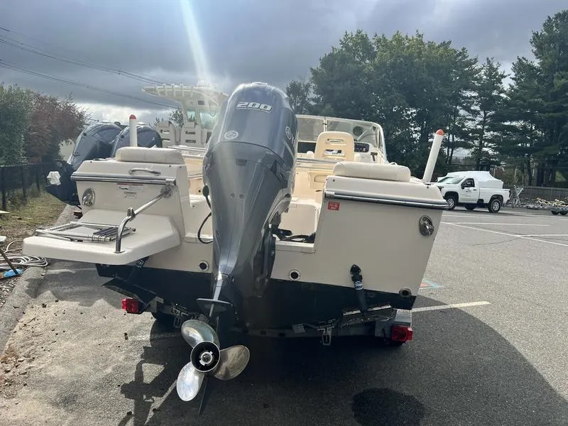 Slide: The Image of 2017 Grady-White 205 Freedom boat with outboard motor in parking lot. - 11