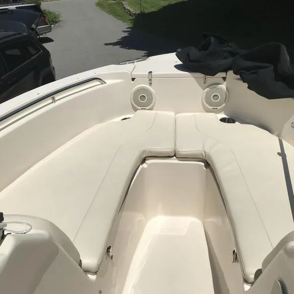 Slide: The Image of 2017 Grady-White 205 Freedom boat interior with white seating and speakers. - 7