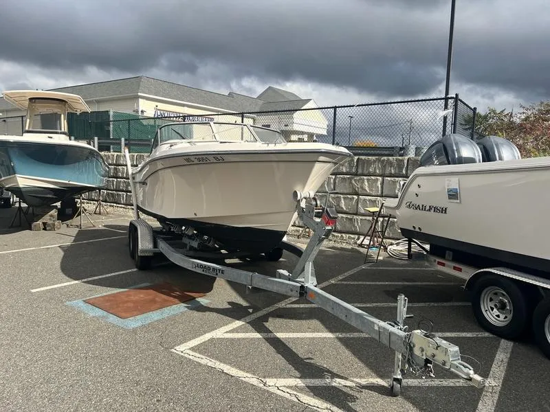 Slide: The Image of 2017 Grady-White 205 Freedom boat on trailer in parking lot. - 8