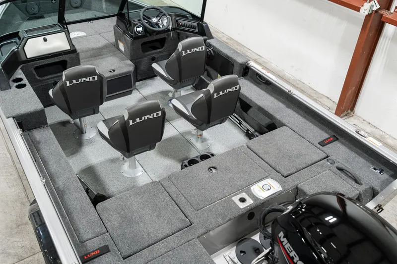 Slide: The Image of 2025 Lund 1875 Impact boat interior with four seats and Mercury engine. - 11