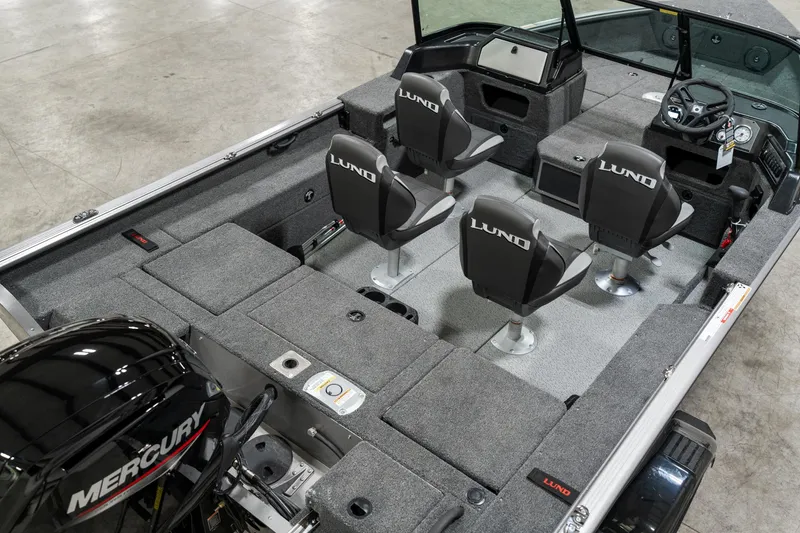 Slide: The Image of 2025 Lund 1875 Impact boat interior with Mercury engine, featuring four seats and spacious layout. - 12