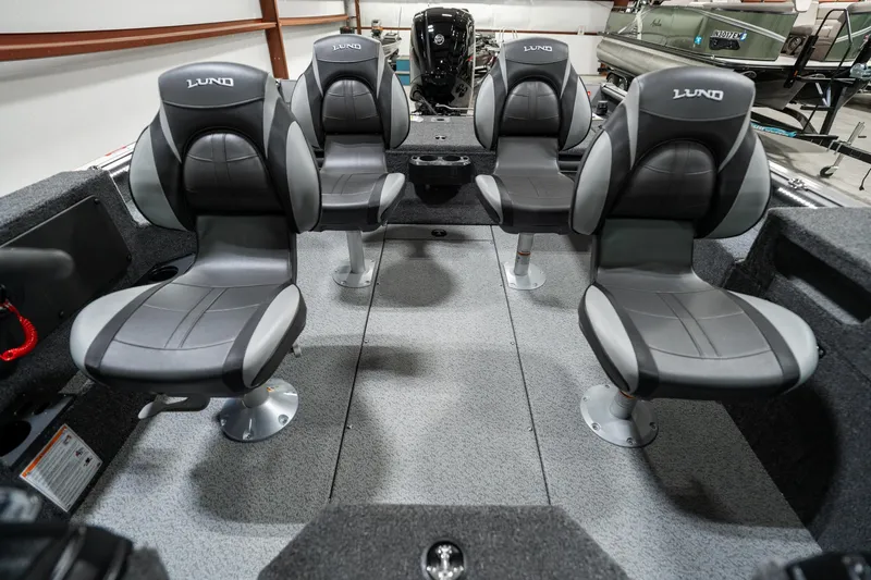 Slide: The Image of 2025 Lund 1875 Impact boat interior with four cushioned seats. - 14