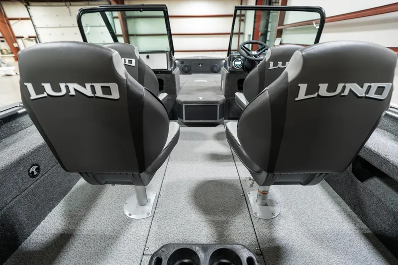 Slide: The Image of 2025 Lund 1875 Impact boat interior with two seats and steering console. - 16