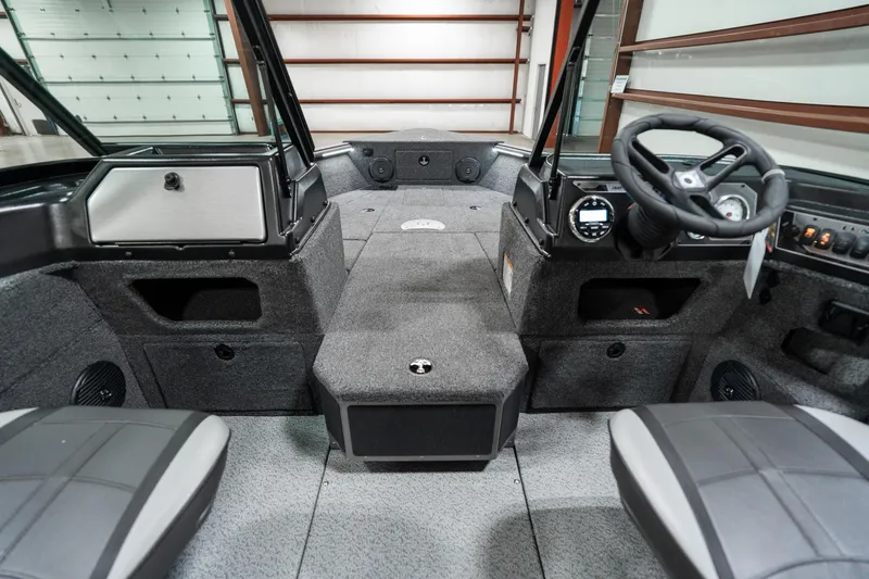 Slide: The Image of 2025 Lund 1875 Impact boat interior with modern dashboard and seating. - 17