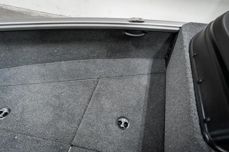 Slide: The Image of 2025 Lund 1875 Impact boat interior with gray carpeted flooring. - 22