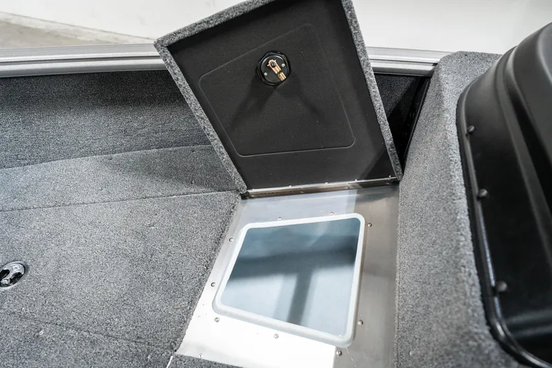 Slide: The Image of 2025 Lund 1875 Impact boat storage compartment with open hatch. - 23