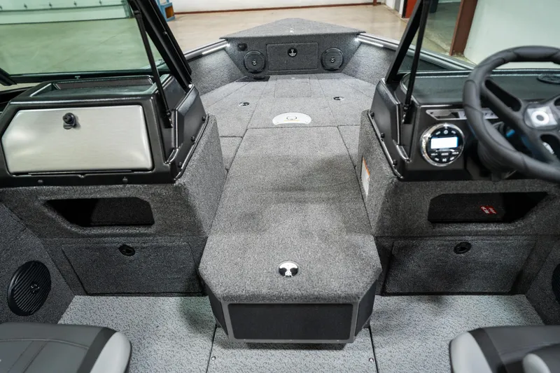 Slide: The Image of 2025 Lund 1875 Impact boat interior with modern dashboard and seating. - 25